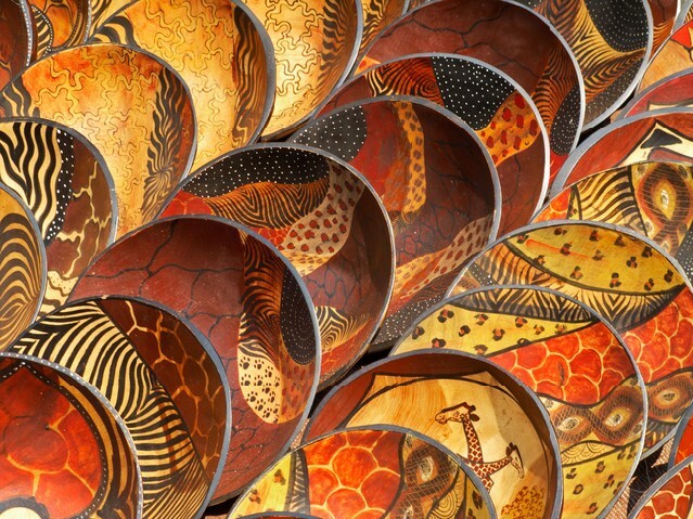 Decorated hand made wooden bowls carved from the wood of indigenous African trees